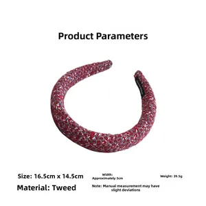 Detailed view of red tweed headband with size specs 16.5x14.5cm and handmade label