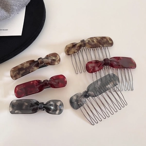 Detailed set of handmade acetate hair clips and combs in marble patterns and classic tones