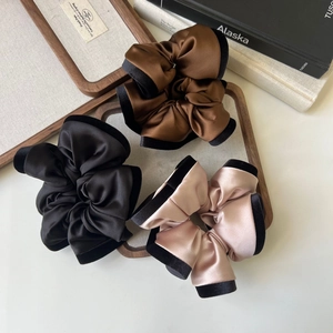 Three-piece set of satin hair scrunchies with velvet trim in brown black and pink