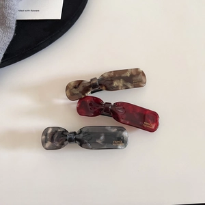 Three-piece set of elegant acetate hair clips in tortoiseshell and marble patterns
