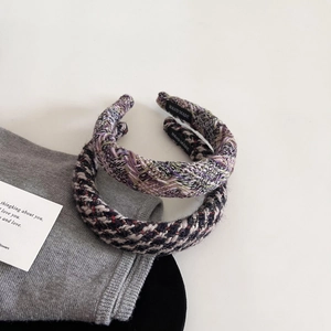 Detailed macro view of handmade tweed headbands featuring premium colorful woven texture