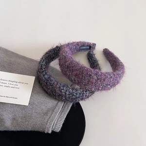 Close-up of handmade tweed headbands with sequins and handmade label detailing