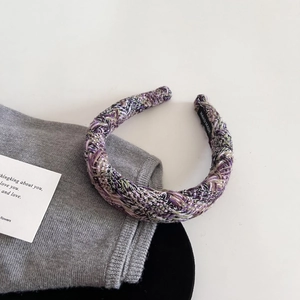 Close-up of handmade purple tweed headband with soft woven texture and hand-made label