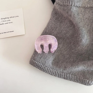 Pink marble acetate hair claw clip with subtle glitter and elegant French lettering