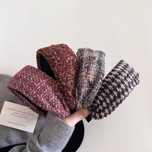 Detail of four colorful tweed headbands with premium woven texture and thick vintage style