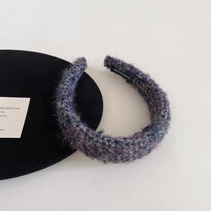 Detail of wool tweed headband with mixed blue-purple knit and handmade label