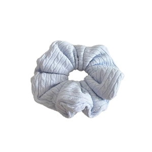 Light blue knit chunky scrunchie with cable knit texture for women winter hairstyles