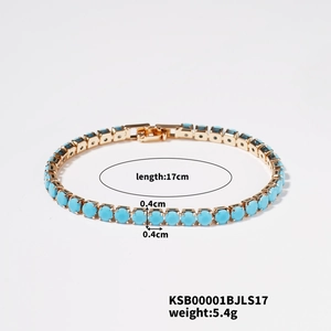 Detail of blue cubic zirconia tennis bracelet with gold plating and security clasp