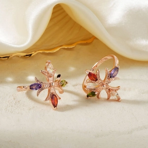 Elegant rose gold star rings set with colorful marquise-cut zircon stones on silk