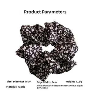 Detail view of 18cm large floral scrunchie showing its fabric texture and dimensions