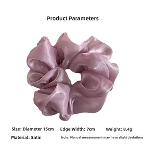 Detail view of light purple pearlescent organza scrunchie with 15cm diameter size