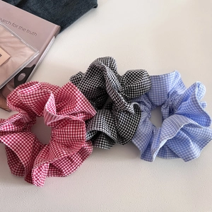 Three Gingham double-layer scrunchies in red, black, and blue colors for bun hair styling