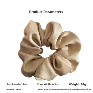 Detailed dimensions of champagne satin scrunchie with 14cm diameter and 6.5cm width