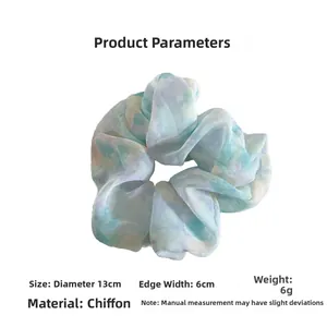 Detail view of tie-dye chiffon scrunchie with 13cm diameter and 6cm width size dimensions