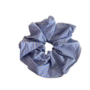 Blue and white striped scrunchie made of soft cotton fabric for ponytail hairstyles