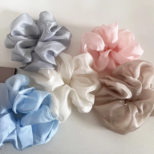 Set of five elegant organza hair scrunchies in pastel colors with soft satin luster