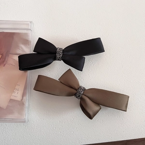 Elegant satin bow hair clips set with rhinestones in black and dark coffee brown