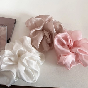 Three-piece set of large organza hair scrunchies in cream, champagne, and soft pink shades
