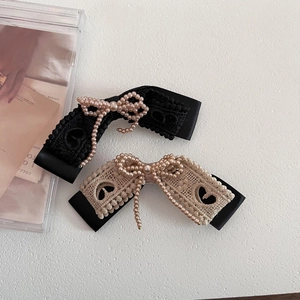 Vintage lace and pearl bow hair clips set in black and apricot for elegant styling