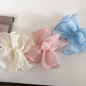 Detailed texture of off-white pink and blue double-layer mesh hair scrunchies