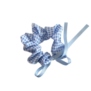 Blue gingham check scrunchie with ribbons for ponytail styling in sweet school style