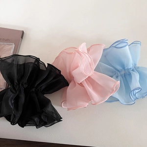 Three-piece organza scrunchies in black, pink, and blue showing delicate pleated fabric