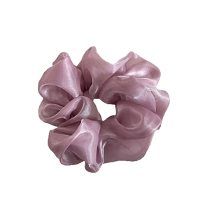 Elegant lavender organza scrunchie with soft pleats and shimmering fabric for hair