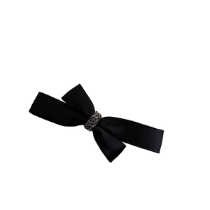 Elegant black satin bow hair clip with sparkling rhinestone centerpiece for women