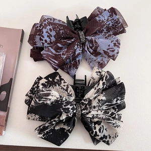 Elegant multi-layer ink print bow hair claw clips with marble pattern and rhinestone center