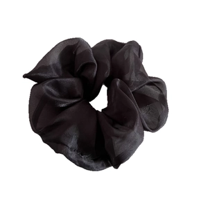 Elegant black tulle organza oversized scrunchie hair tie with pleated texture on white background