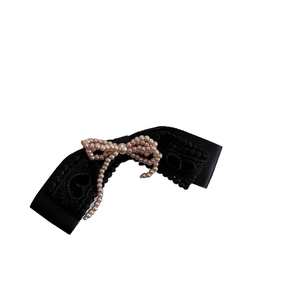 Vintage black lace hair clip with pink pearl bow detail for women on white background