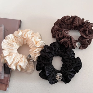 Three-piece set of satin scrunchies with crystal rhinestones in beige, brown, and black