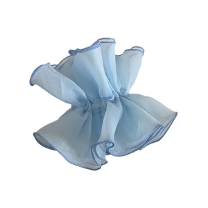 Light blue double-layer organza hair scrunchie with navy blue piping on white background