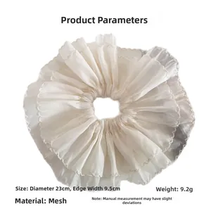 Detail showing oversized white organza scrunchie dimensions 23cm diameter and 9.5cm width