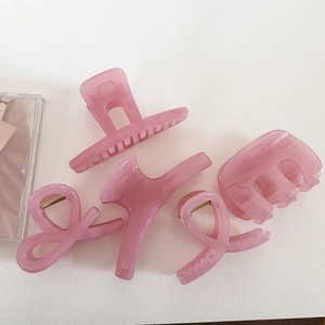 Set of five translucent ice rose pink resin hair claws in various elegant shapes