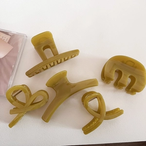 Set of five olive green hair claws in rectangular and curved shapes with glossy finish