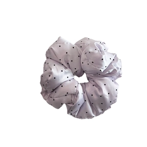 Satin polka dot hair scrunchie in light purple with fluffy pleated fabric texture