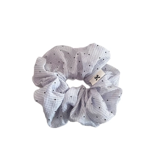 French style light blue polka dot hair scrunchie with pleated texture and logo label