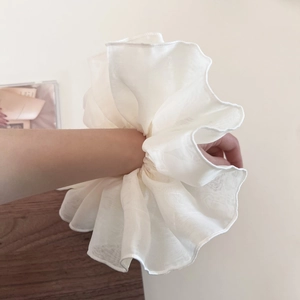 French style oversized white organza scrunchie with fluffy ruffles worn on wrist
