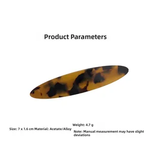 Detail showing acetate hair clip dimensions 7x1.6cm with tortoise shell texture and alloy clip