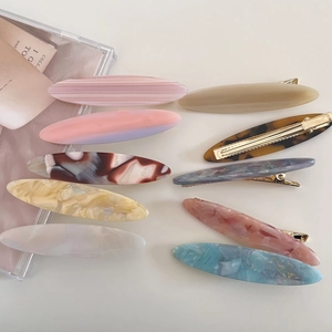 Elegant oval acetate hair clips in assorted marble textures and macaron colors for women