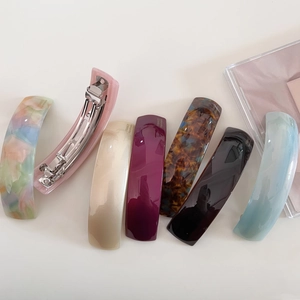 Set of 7 colorful acetate hair clips in floral, tortoiseshell, and solid tones for women