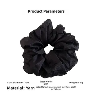 Detail view of 17cm black mesh scrunchie with sparkling dots and size specifications