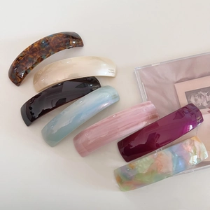 Elegant multi-color acetate hair clips in classic tortoise and pearlescent finishes