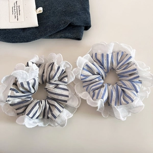 Blue and white striped scrunchie set with white lace ruffle edges for elegant ponytails