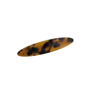 Elegant tortoise shell acetate oval hair clip in brown and black for a minimalist look
