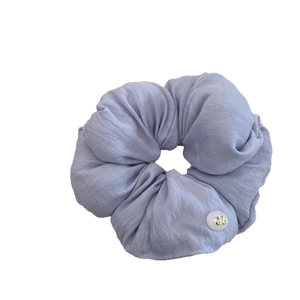 Light blue cream puff oversized hair scrunchie with a gold letter V charm detail