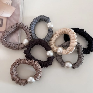7-piece set of satin scrunchies with large pearls in assorted elegant colors for women