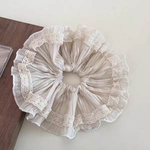 Elegant beige lace ruffle scrunchie made of pleated chiffon fabric for hair styling