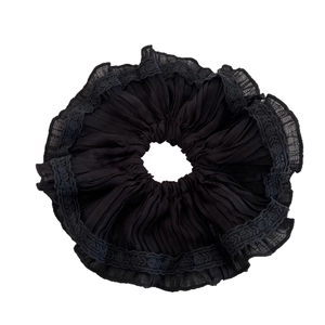 Elegant black pleated chiffon scrunchie with delicate lace embroidery trim for hair styling